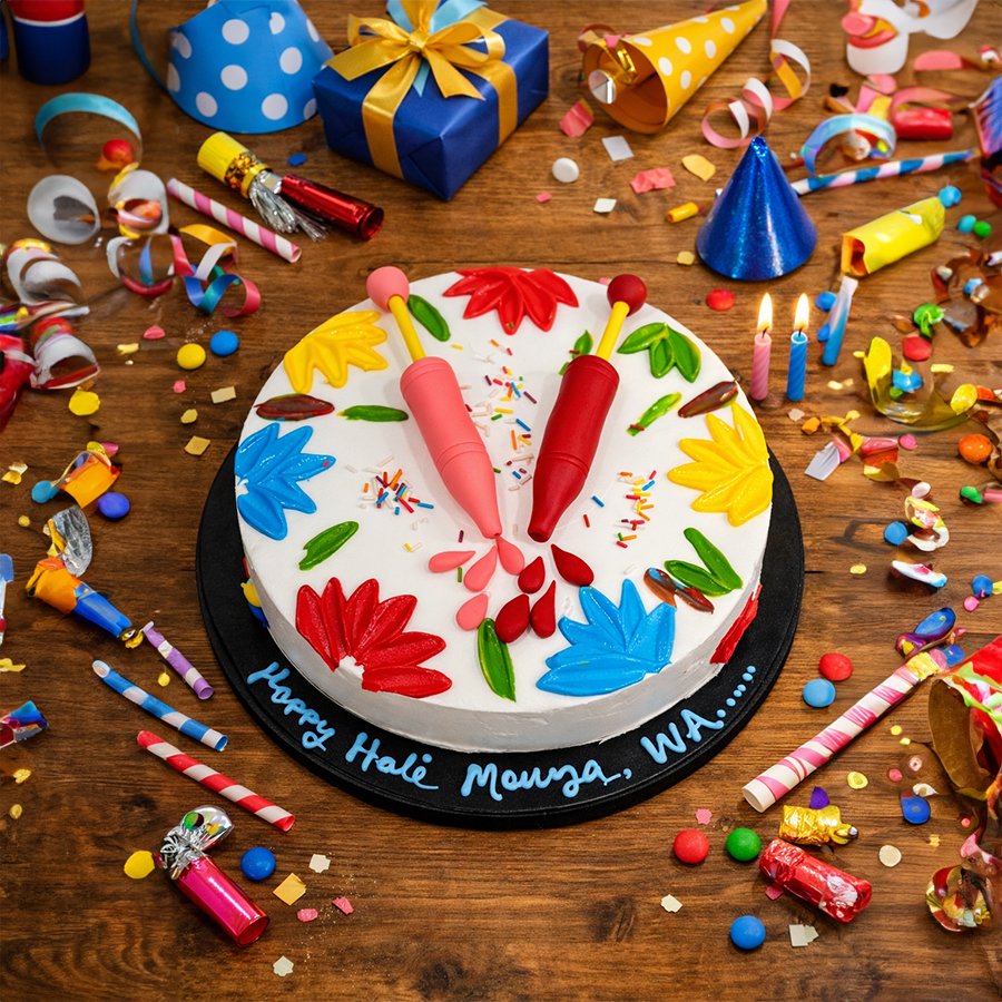 Vibrant Holi Festival Cream Cake with Pichkari Designs